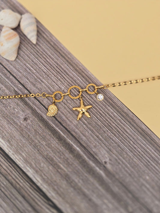 bracelet breloque avec une étoile de mer un coquillage et un strass